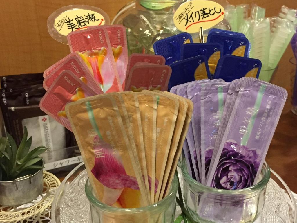a group of glass jars filled with different types of food at Hotel Citio Shizuoka in Shizuoka