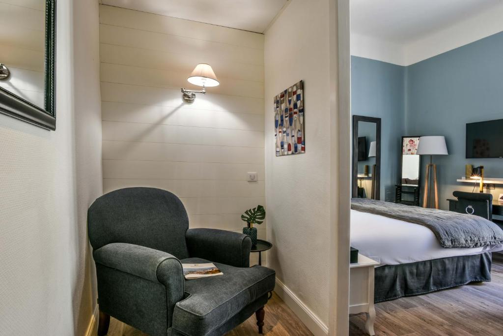 Voodi või voodid majutusasutuse Hotel De L'Océan toas