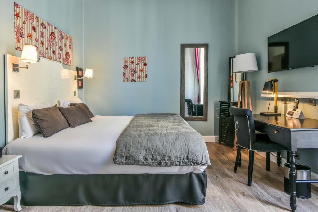 Voodi või voodid majutusasutuse Hotel De L'Océan toas