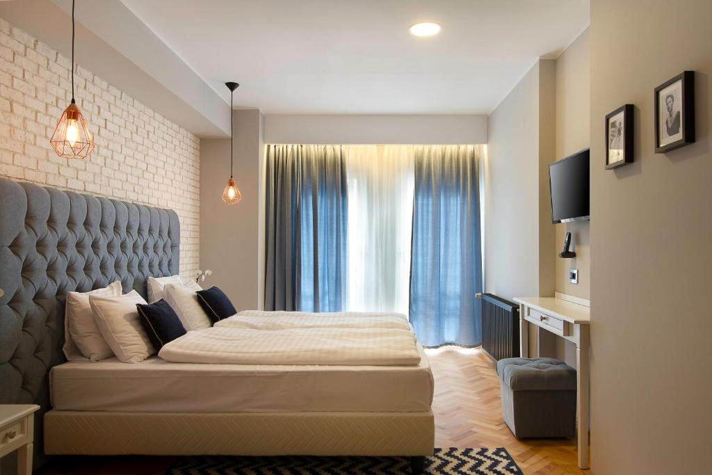 Venis Boutique Hotel 객실 침대
