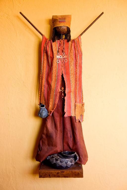 a dress hanging on a wall at Hotel Santa Cruz Plaza in Santa Cruz