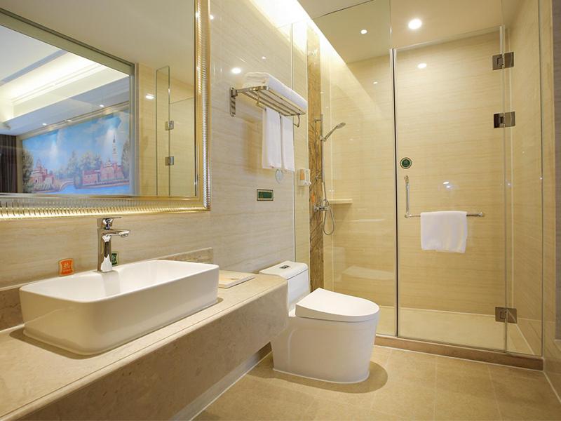 a bathroom with a sink and a toilet and a shower at Vienna Hotel Guangzhou Baiyun Airport in Guangzhou