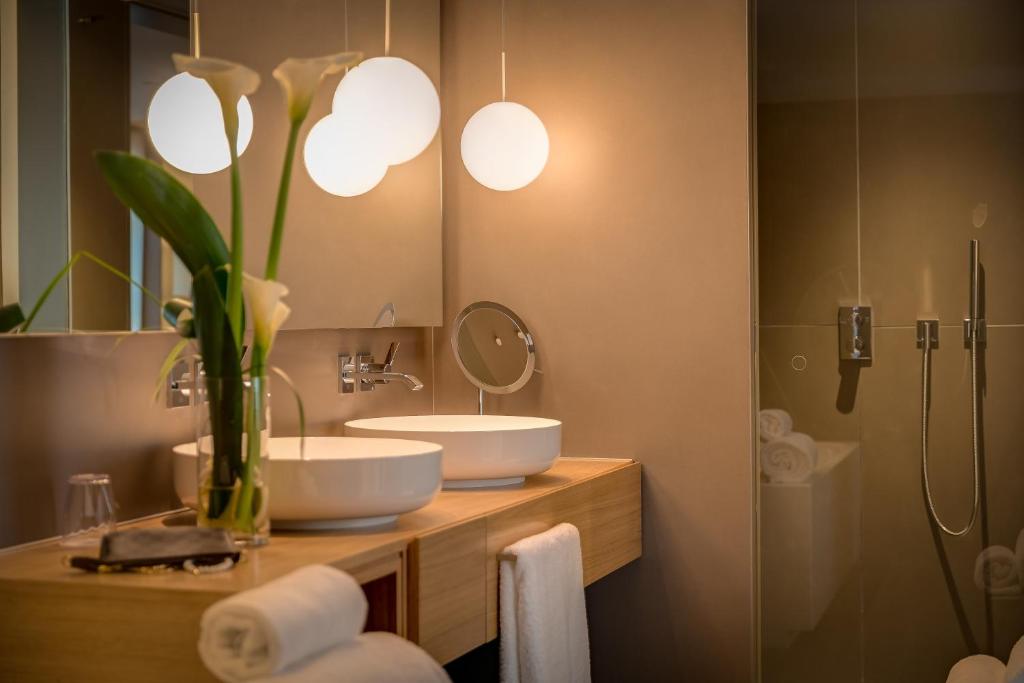 a bathroom with two sinks and a mirror at Ohla Eixample in Barcelona