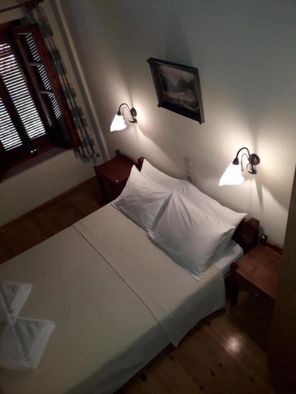Cama ou camas em um quarto em Villa Orestis