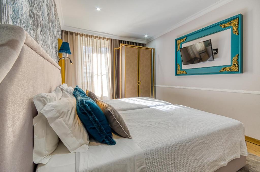 Uma cama ou camas num quarto em Hotel Borges Chiado