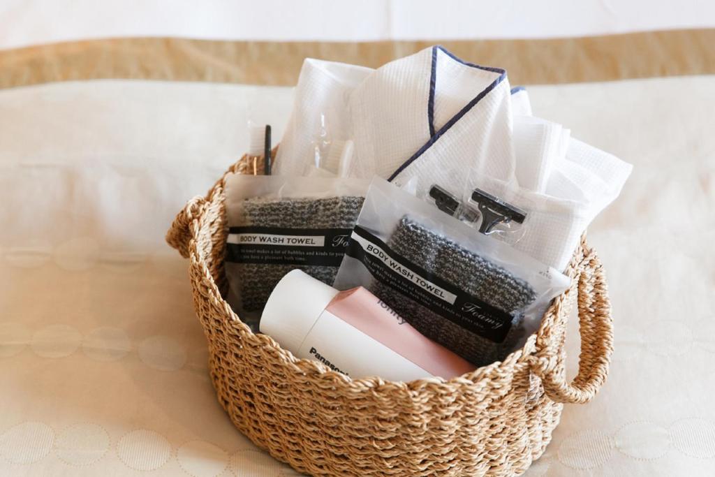 a basket filled with books and papers on a table at Sutton Place Hotel Ueno in Tokyo
