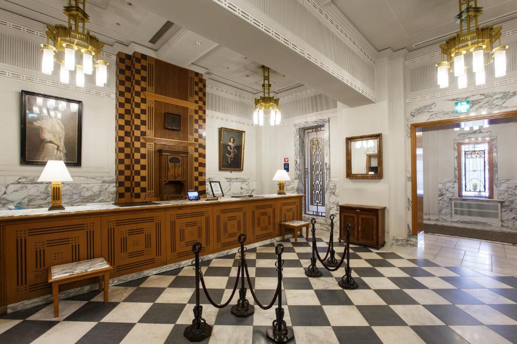 a large room with a hair salon with a checkered floor at Hotel Monterey Edelhof Sapporo in Sapporo