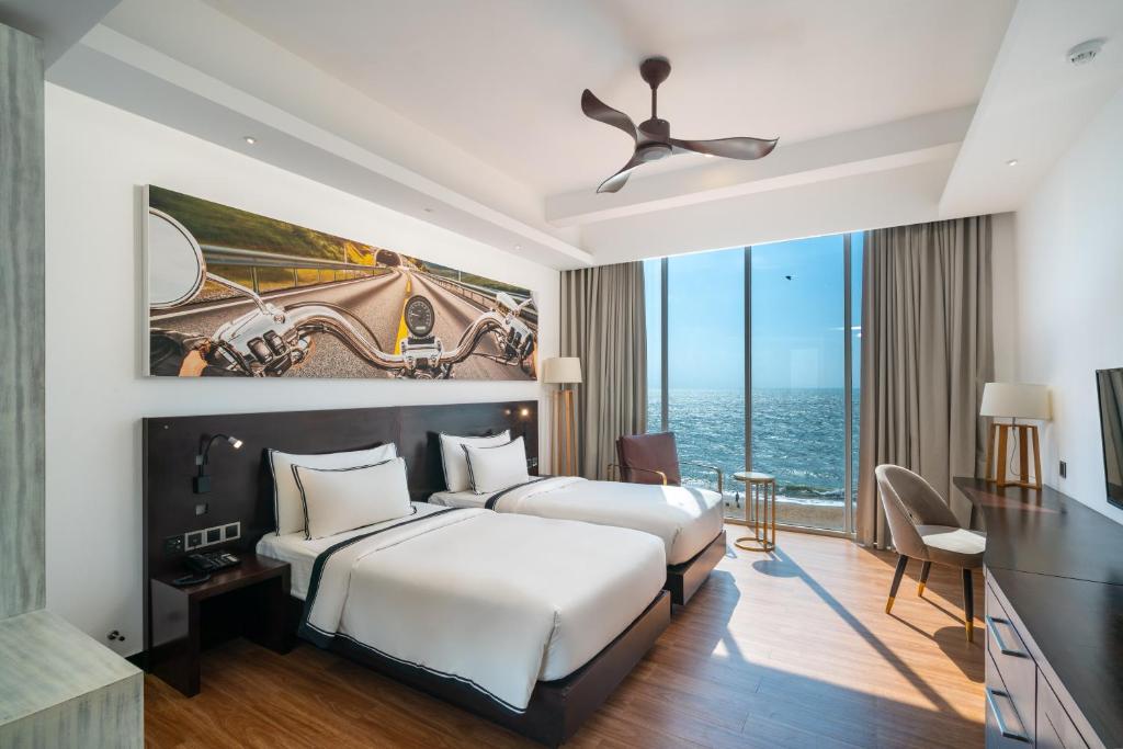 Rúm í herbergi á Regal Réseau Hotel & Spa