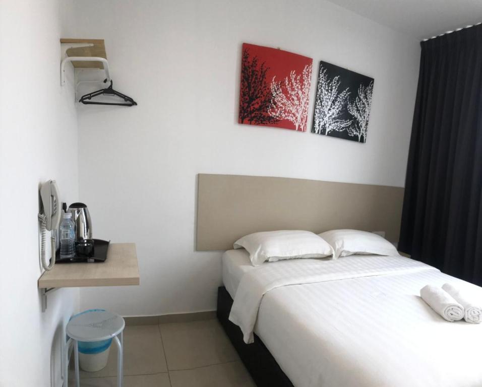 Säng eller sängar i ett rum på M Design Hotel@KLIA,Sepang