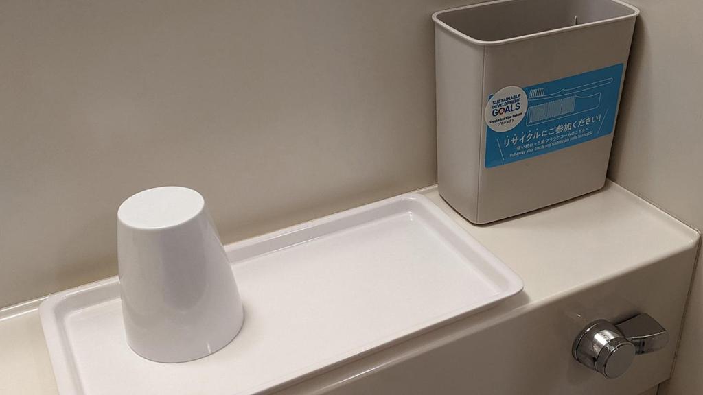a white counter with a box on top of it at Toyoko Inn Fukuyama-eki Shinkansen Minami-guchi in Fukuyama