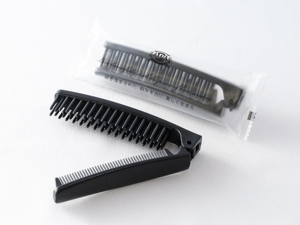a black comb and a white plastic bag at APA Hotel Nagasaki Dejima in Nagasaki