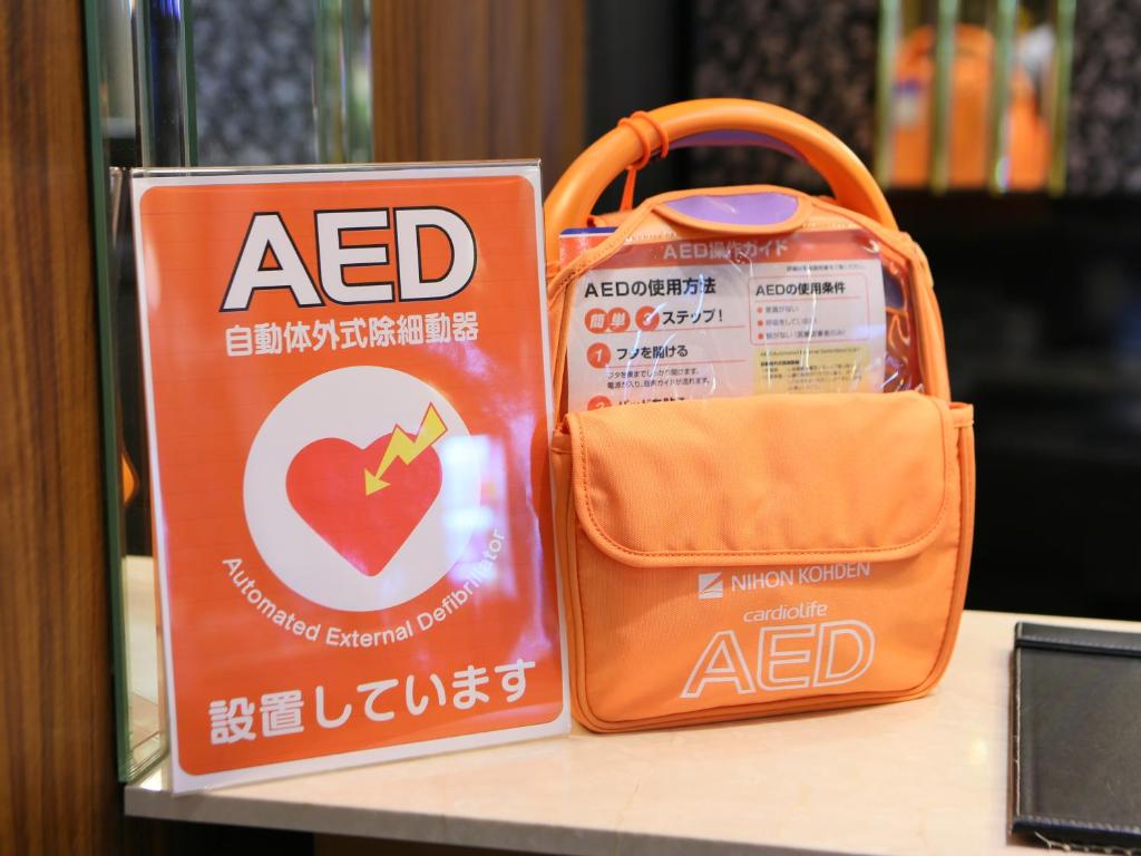 a bag of acid sitting on a table next to a purse at APA Hotel Nagasaki Dejima in Nagasaki