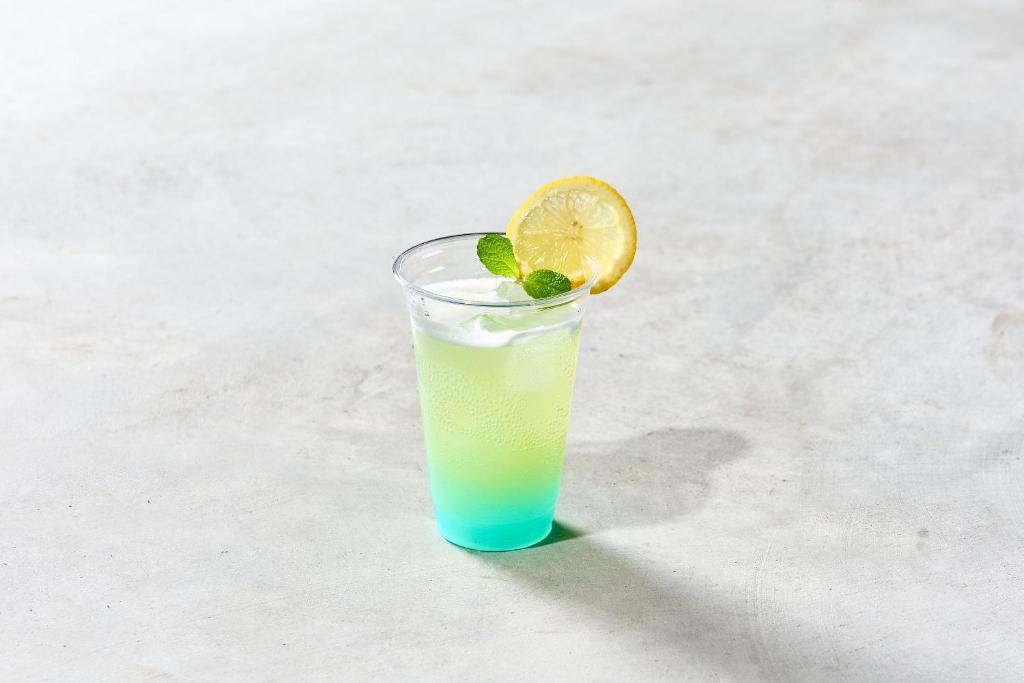 a drink with an orange slice in a glass at WHARFandCO in Himi