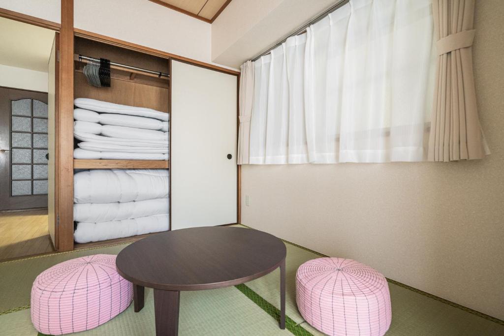 Vuode tai vuoteita majoituspaikassa Park Residence Omori