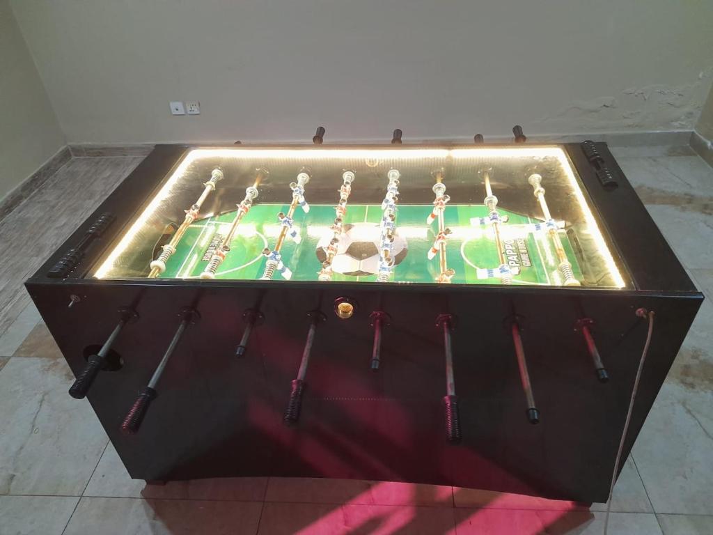 a tool box with a table with a cake on it at Grand Regent Hotel and Suites in Faisalabad