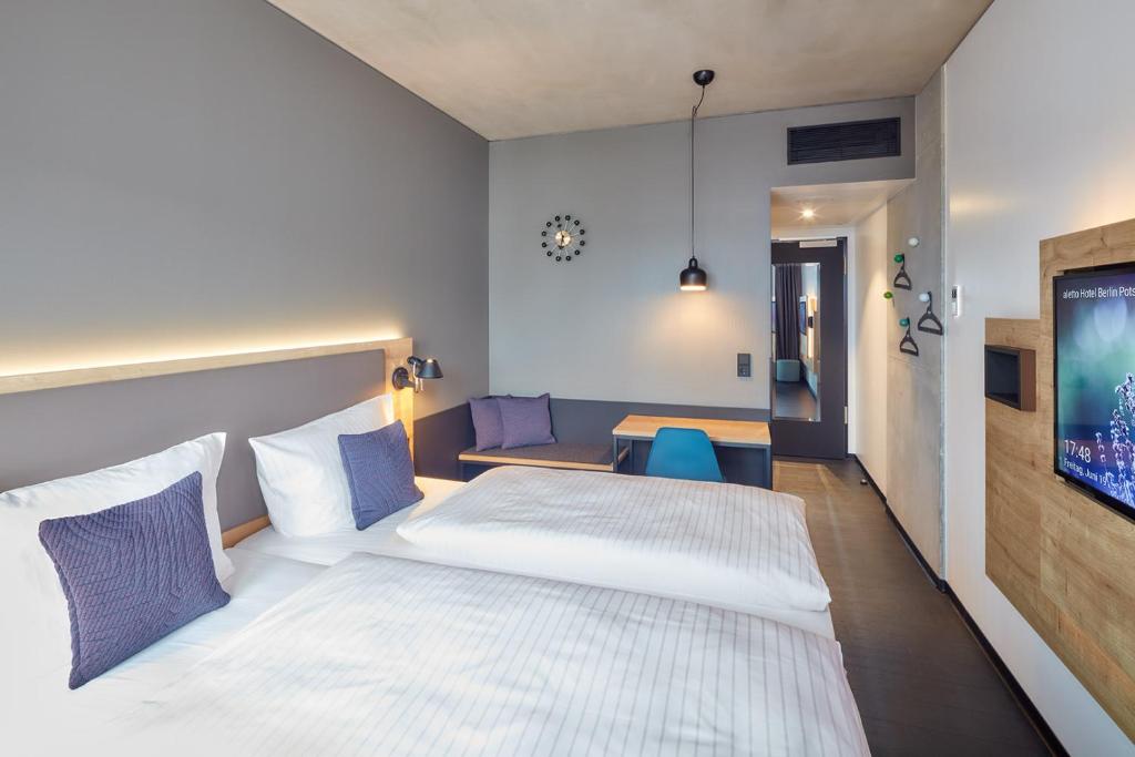 Ліжко або ліжка в номері aletto Hotel Potsdamer Platz