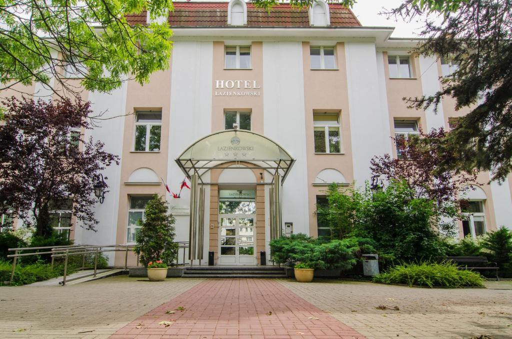 a building with an arch in front of it at Hotel Łazienkowski in Warsaw