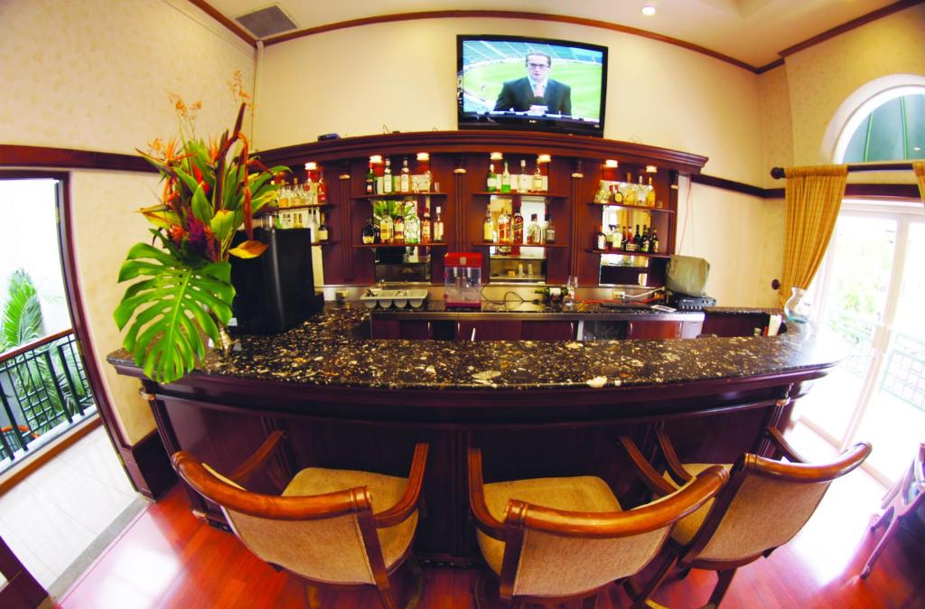 Een TV en/of entertainmentcenter bij Apartotel & Suites Villas del Rio
