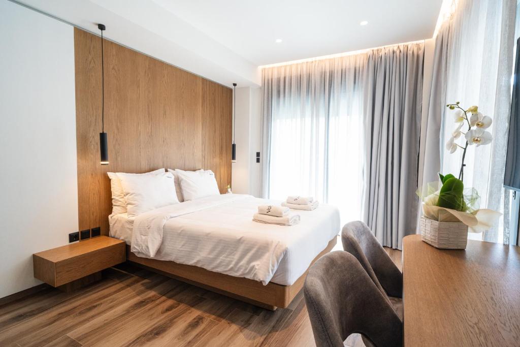 Krevet ili kreveti u jedinici u okviru objekta Volos Inn Hotel
