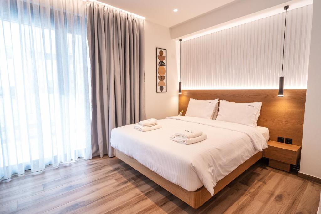 Krevet ili kreveti u jedinici u okviru objekta Volos Inn Hotel