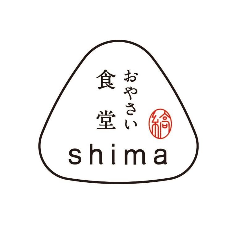a drawing of a egg with chinese writing on it at Ten to Sen Guesthouse in Takamatsu