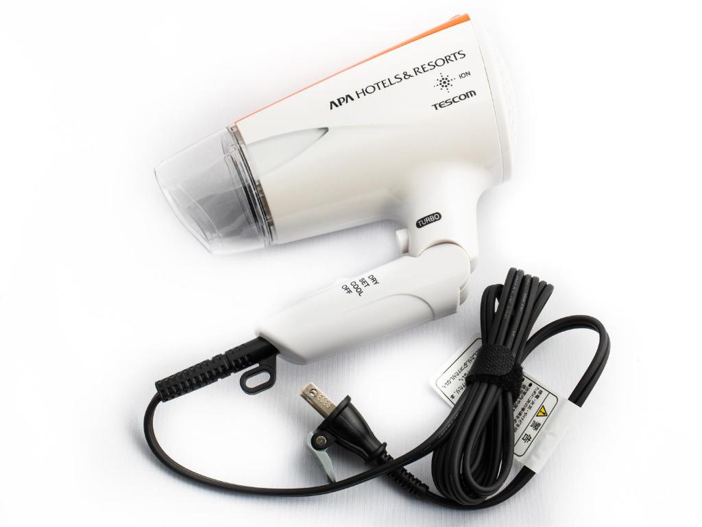 a hair dryer with a cord and a blow dryer at APA Hotel Nagasaki Ekiminami in Nagasaki