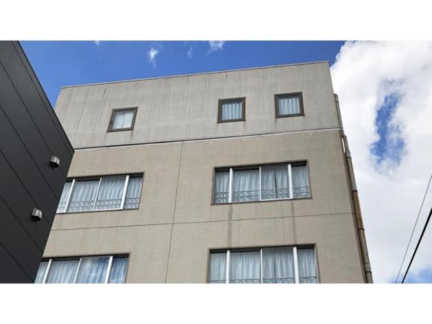 a tall building with windows on top of it at Kagetsu Ryokan - Vacation STAY 04882v in Shizuoka