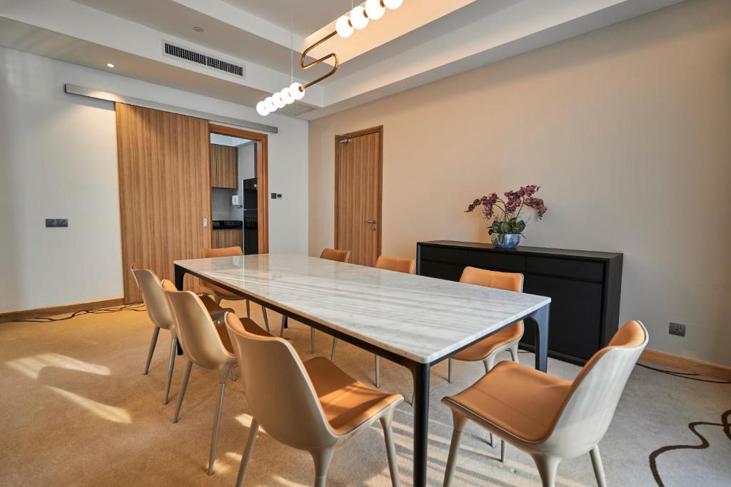 a conference room with a large table and chairs at Holiday Inn Sepang - Airport in Sepang