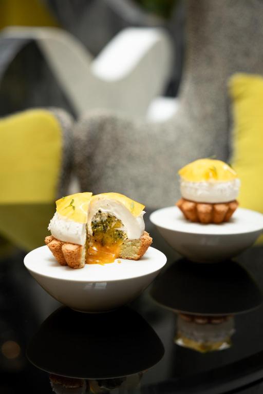 two plates of food on top of a table at Le Burgundy Paris in Paris