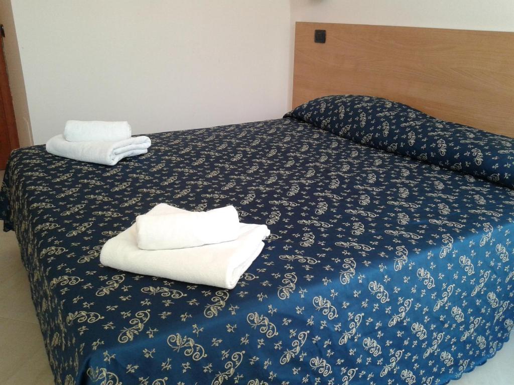 Letto o letti in una camera di Sun Moon