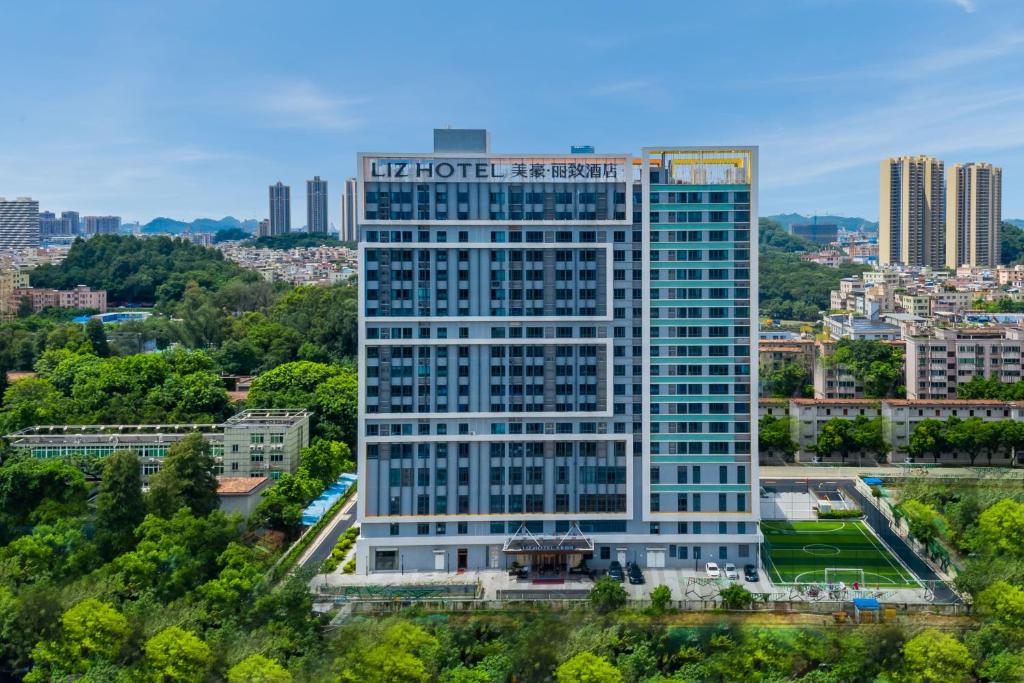 an aerial view of a tall building in a city at LIZ International Hotel Guangzhou Olympic Sports Center International Financial City Branch - Free Shuttle Bus to Canton Fair Complex During Canton Fair Period & Free Breakfast & Free Afternoon Tea & Free Midnight Snack in Guangzhou
