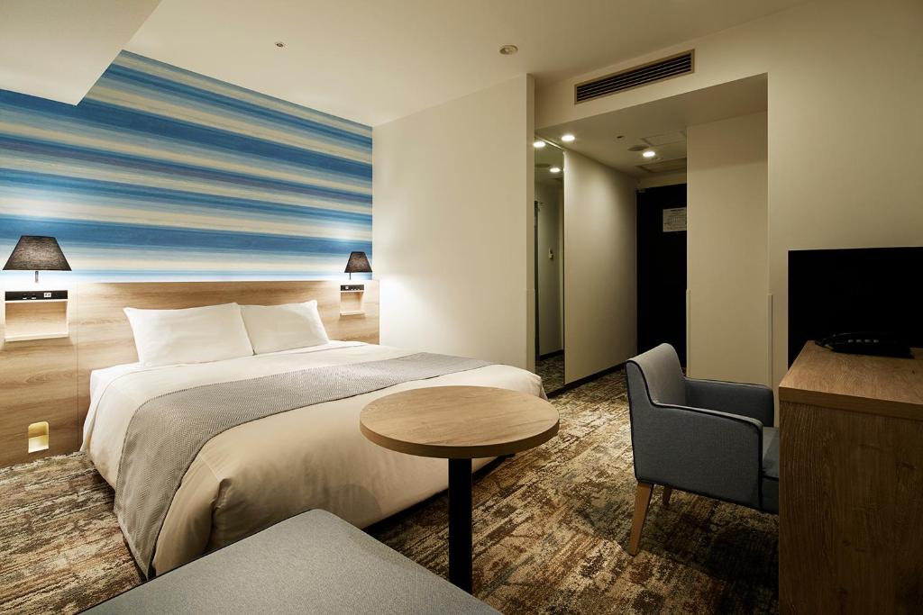 Giường trong phòng chung tại Mitsui Garden Hotel Hiroshima