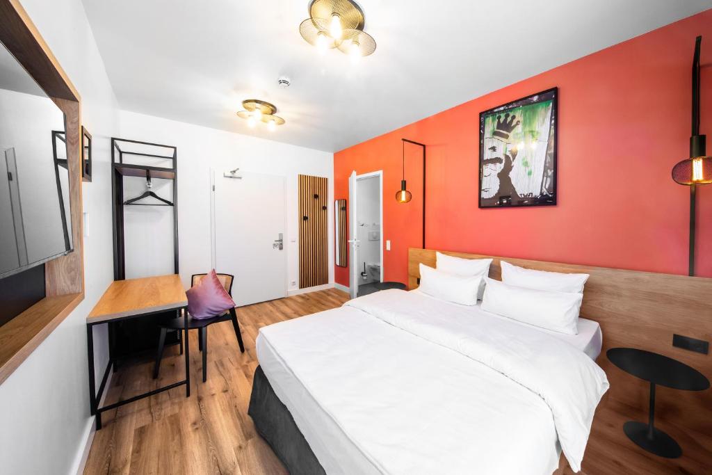 Kama o mga kama sa kuwarto sa CALMA Berlin Mitte