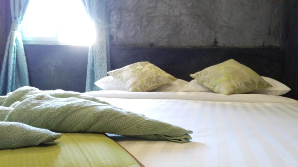 Tempat tidur dalam kamar di La Chambre Boutique @ Ko Lanta