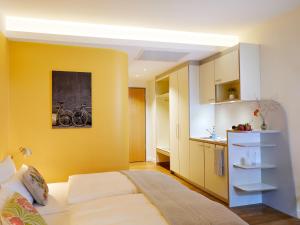 Krevet ili kreveti u jedinici u okviru objekta Flottwell Berlin Hotel & Residenz am Park