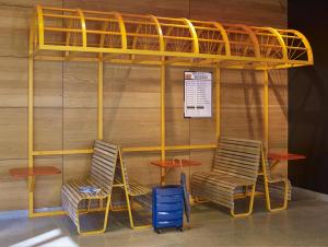 a bunk bed with two chairs and a table at ibis Styles Warszawa City in Warsaw