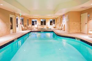 a pool in the middle of a hotel room at Holiday Inn Express Reno Airport by IHG in Reno