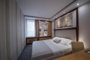 Putnik Inn Belgrade tesisinde bir odada yatak veya yataklar