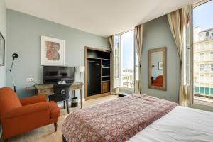 Cama ou camas em um quarto em Hotel De L'Océan