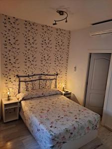 Giường trong phòng chung tại Atico Duplex Marques de Reyes