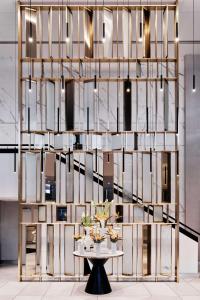 a room with a table and a wall of mirrors at Radisson Collection Hotel, Warsaw in Warsaw +37 photos