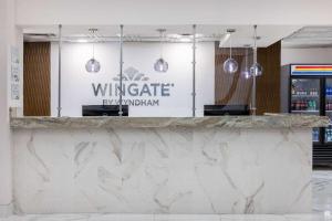 Sertifikāts, apbalvojums, norāde vai cits dokuments, kas ir izstādīts apskatei naktsmītnē Wingate by Wyndham Atlanta Galleria/ Ballpark