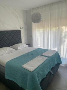 Krevet ili kreveti u jedinici u okviru objekta Tijara Apartment