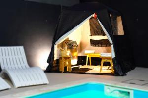 a model of a tent with a table and chairs at ルクス箱根湯本 LUX HAKONE YUMOTO in Hakone