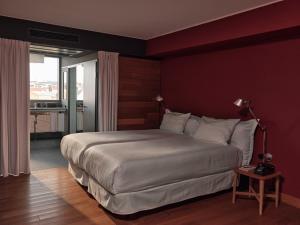 a bedroom with a large bed in a room at Casa Camper Berlin in Berlin +24 photos