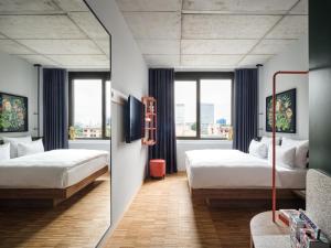 Ліжко або ліжка в номері URBAN LOFT Berlin