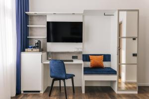 TV in/ali zabaviščno središče v nastanitvi Homaris East Side