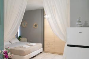 En eller flere senger på et rom på Kalamata beach apartment