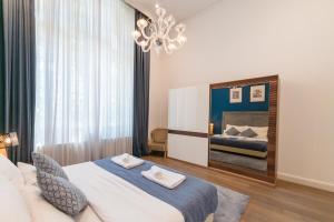 A bed or beds in a room at ZOYA LUXURY RESIDENCE