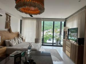 a living room with a couch and a television at Mako 54 in Puerto Vallarta